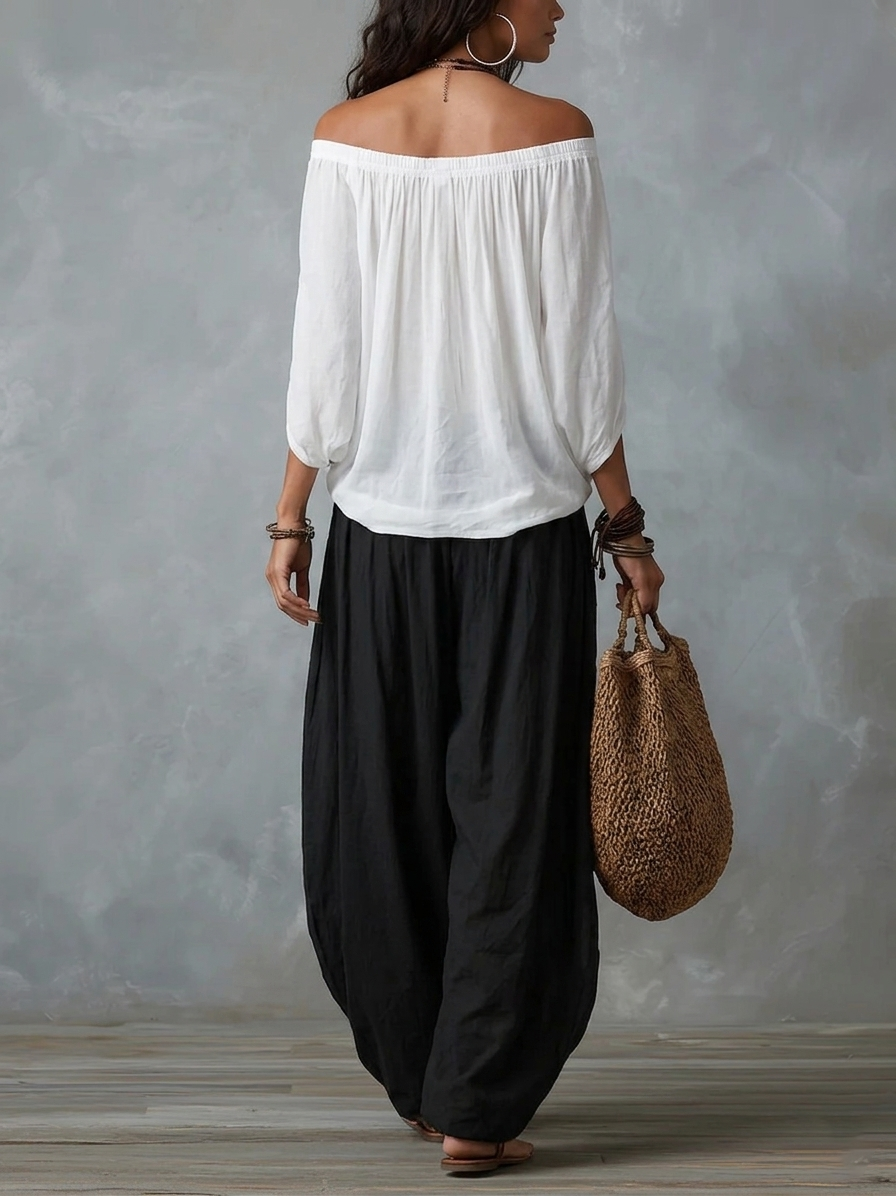 EMILIA · Ensemble composé d'un top blanc à épaules dénudées et d'un pantalon large à pattes d'éléphant