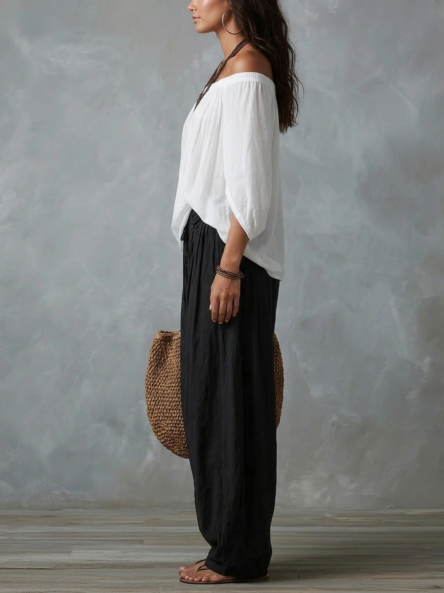 EMILIA · Ensemble composé d'un top blanc à épaules dénudées et d'un pantalon large à pattes d'éléphant
