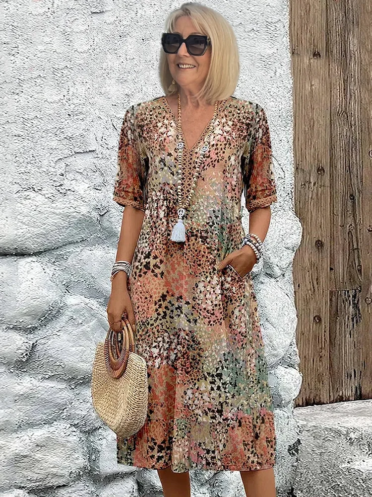 Véronique – Robe midi élégante à coupe fluide