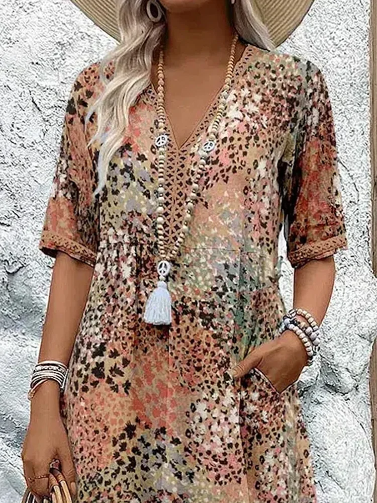 Véronique – Robe midi élégante à coupe fluide