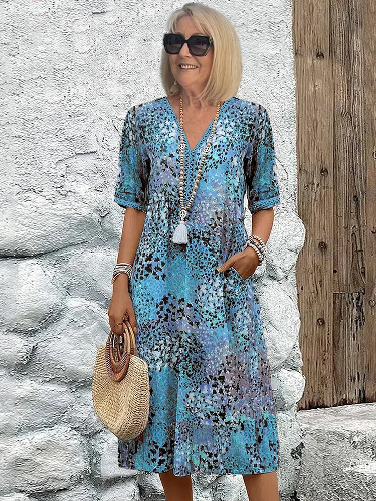 Véronique – Robe midi élégante à coupe fluide